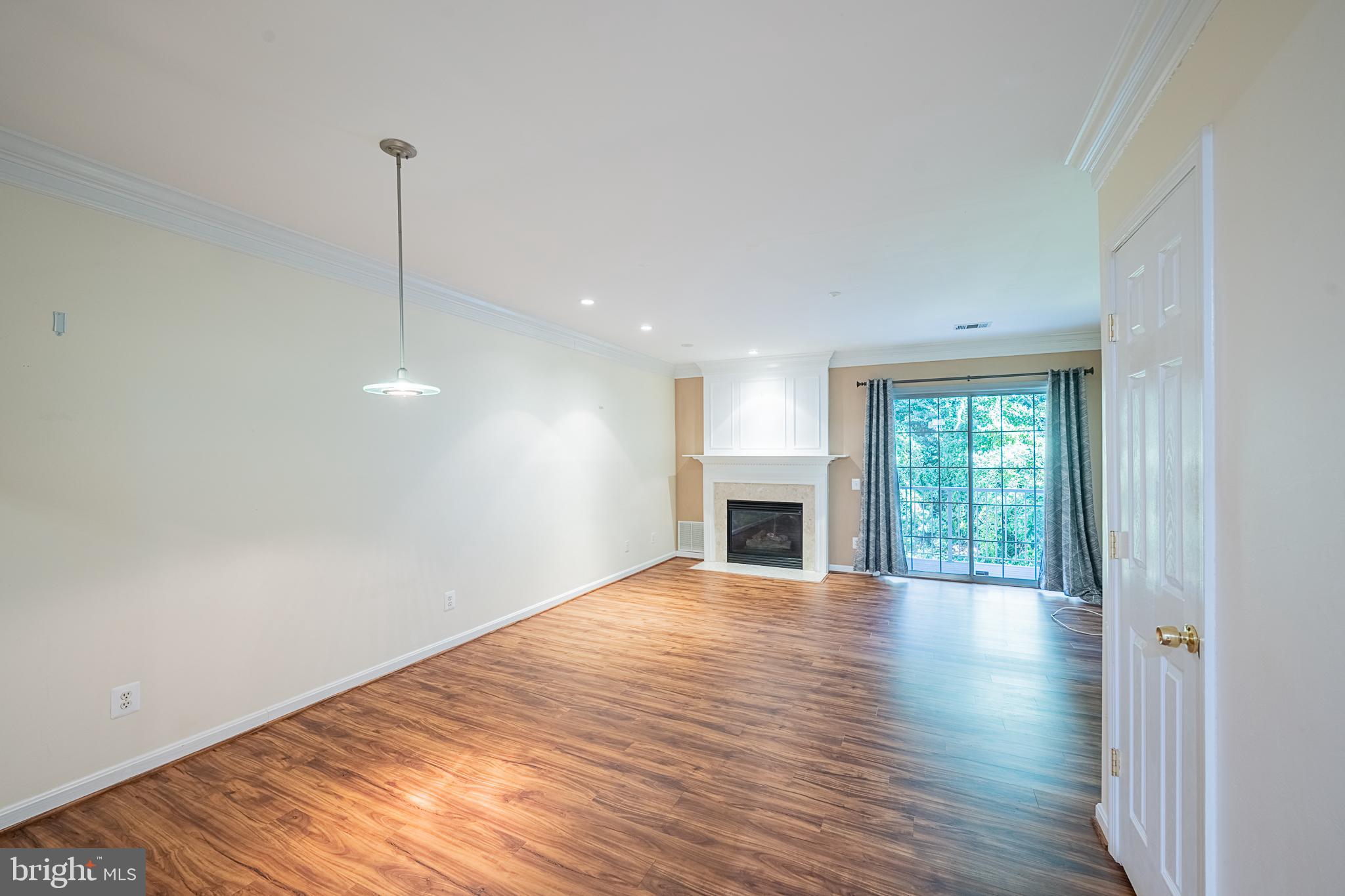 5920 Terrapin Place Alexandria, VA 22310 - Photo 22 of 67 a view of empty room with wooden floor and fireplace