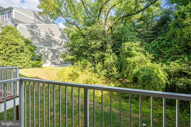 a view of empty room with ceiling fan