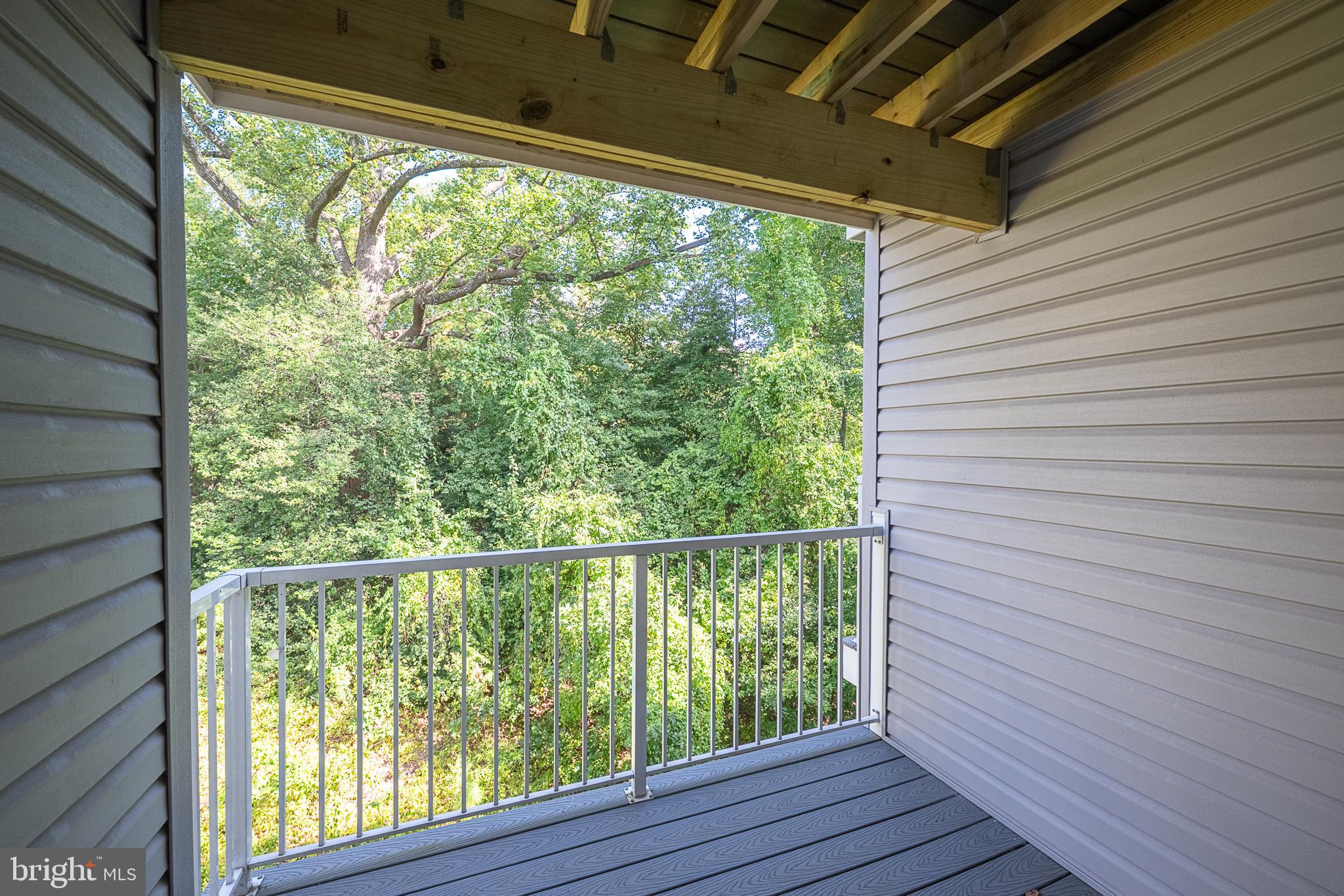 5920 Terrapin Place Alexandria, VA 22310 - Photo 30 of 67 a view of a room with wooden floor and iron stairs