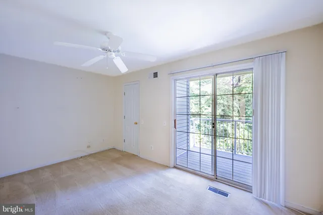 a view of a bathroom from a hallway