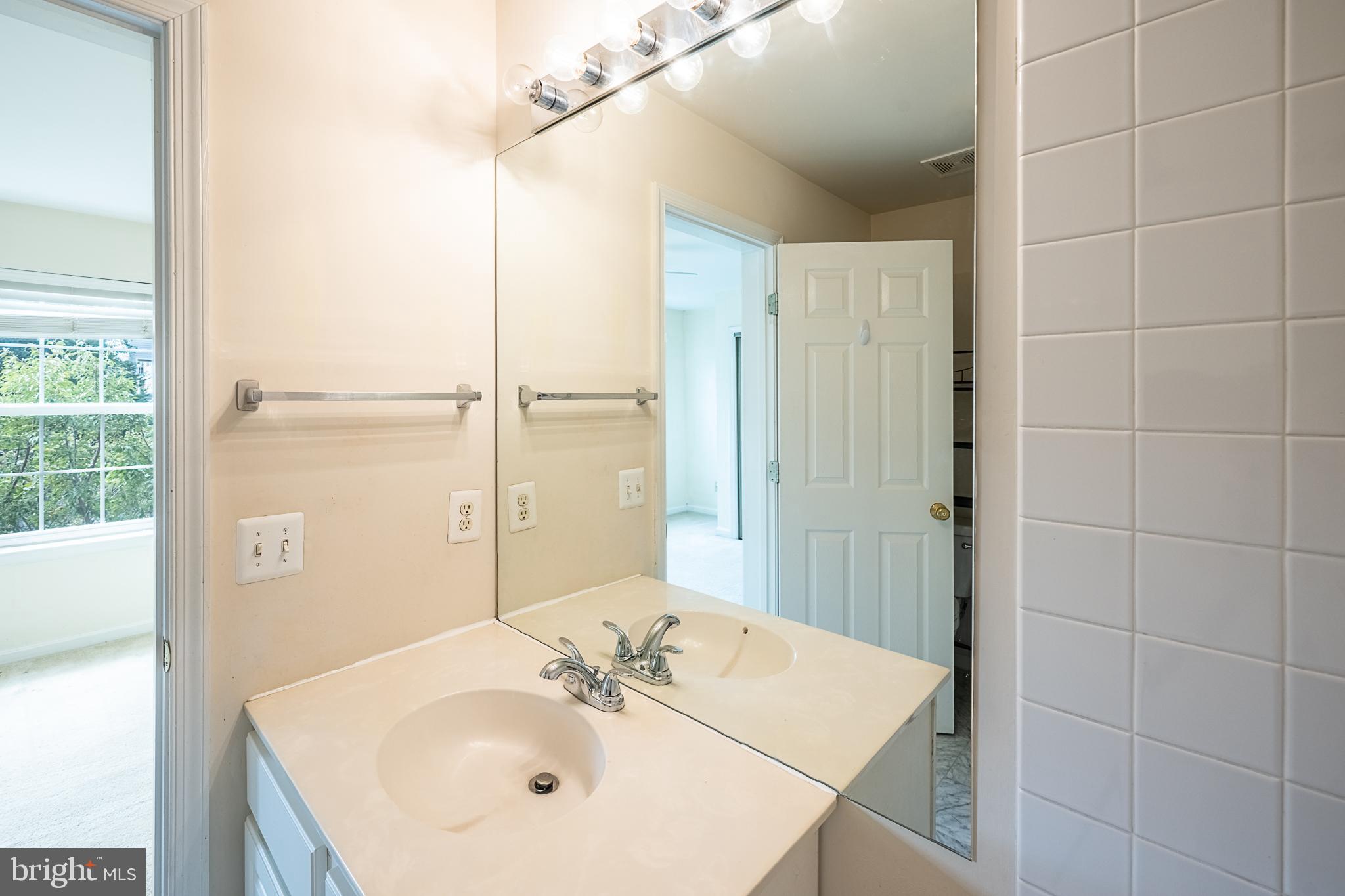 5920 Terrapin Place Alexandria, VA 22310 - Photo 47 of 67 a bathroom with a sink shower and a mirror