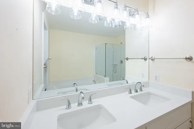 a view of a swimming pool with a chair and tables in the backyard