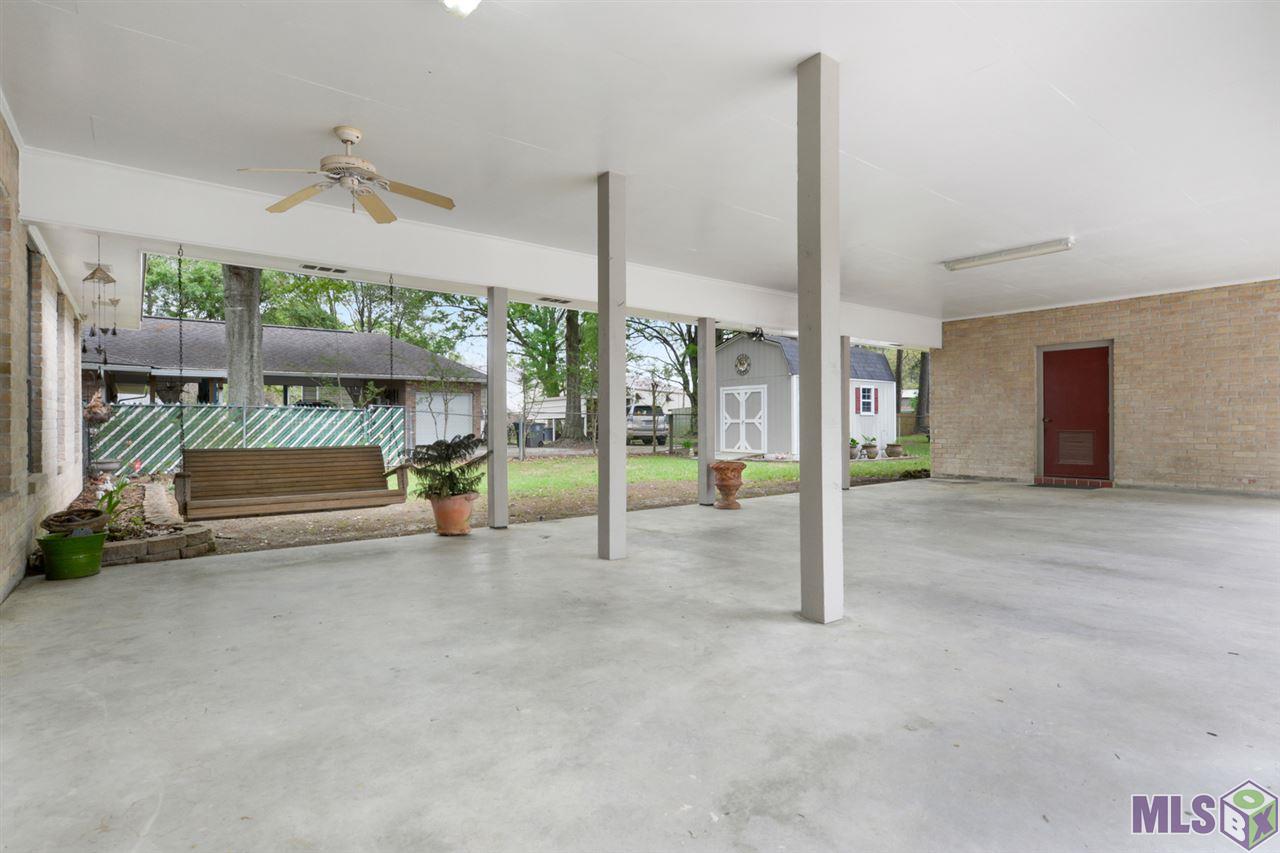 13642 Tech Drive Baton Rouge, LA 70818 - Photo 4 of 15 Cozy Back Porch Swing