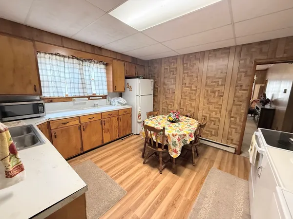 a kitchen with a sink appliances and cabinets