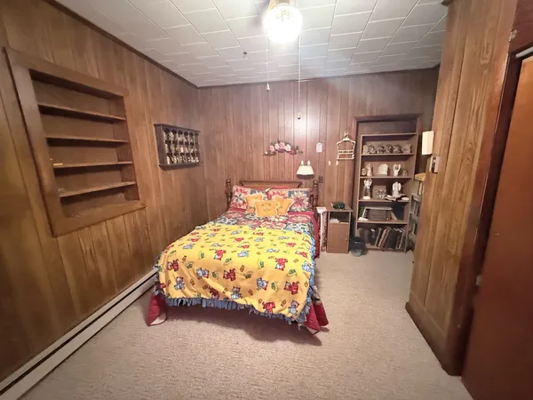 a bedroom with a bed and a cabinets