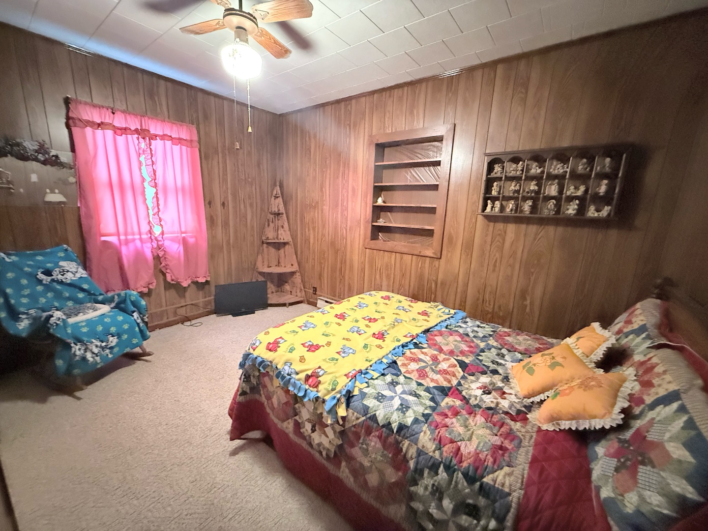 1421 West Maple Street Herrin, IL 62948 - Photo 9 of 15 a bedroom with a bed and a chandelier