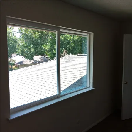 a view of a small space with a large window