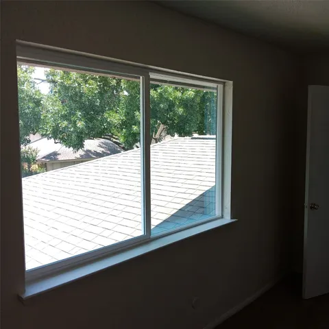 a view of a small space with a large window