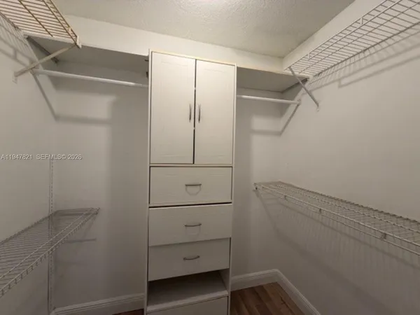 a view of an empty walk in closet