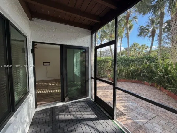 a view of a glass door with a balcony