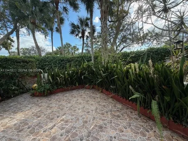 a view of backyard with green space