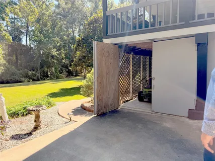 a view of garage with cars