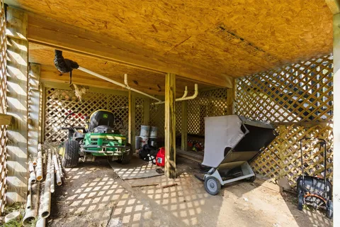 a view of a hallway with mirror on the wall