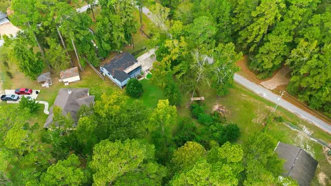 a view of yard with wooden fence