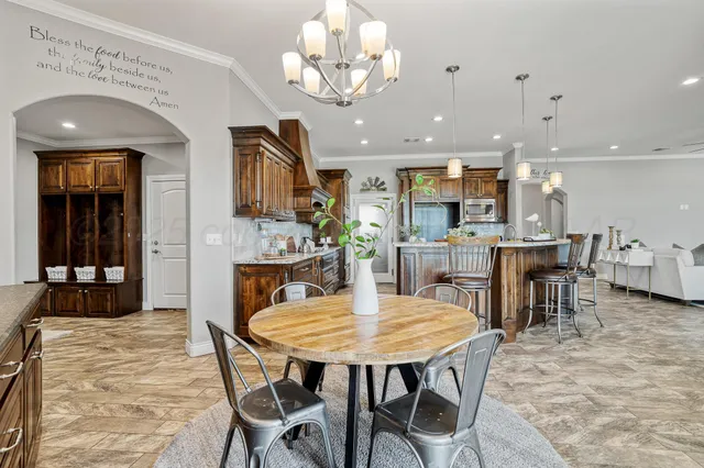 a kitchen with a stove and a refrigerator