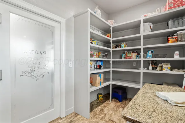 a bedroom with a bed and a book shelf