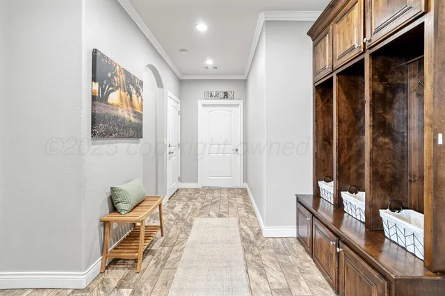 a living room with a rug and a window