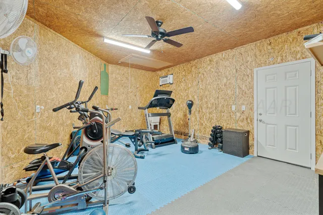 a spacious bedroom with a bed and a couch