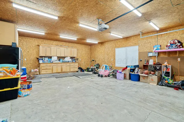 a bathroom with a shower sink and mirror
