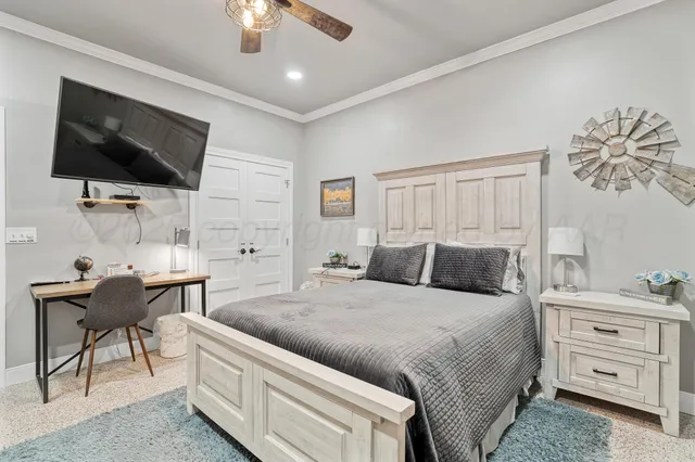 an aerial view of a house with a yard swimming pool and outdoor seating