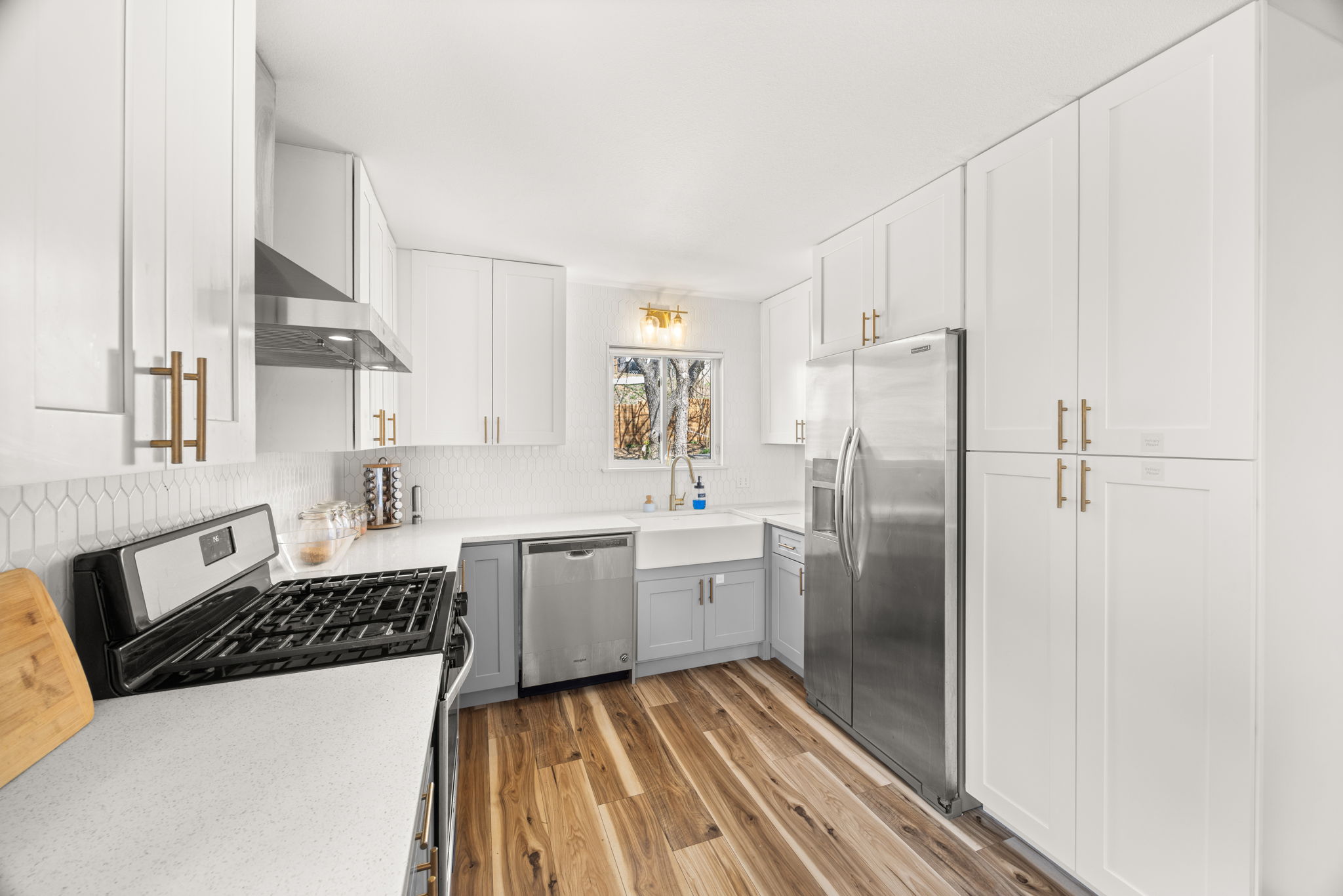 5002 Ledesma Road Austin, TX 78721 - Photo 12 of 32 a kitchen with stainless steel appliances a refrigerator sink and stove