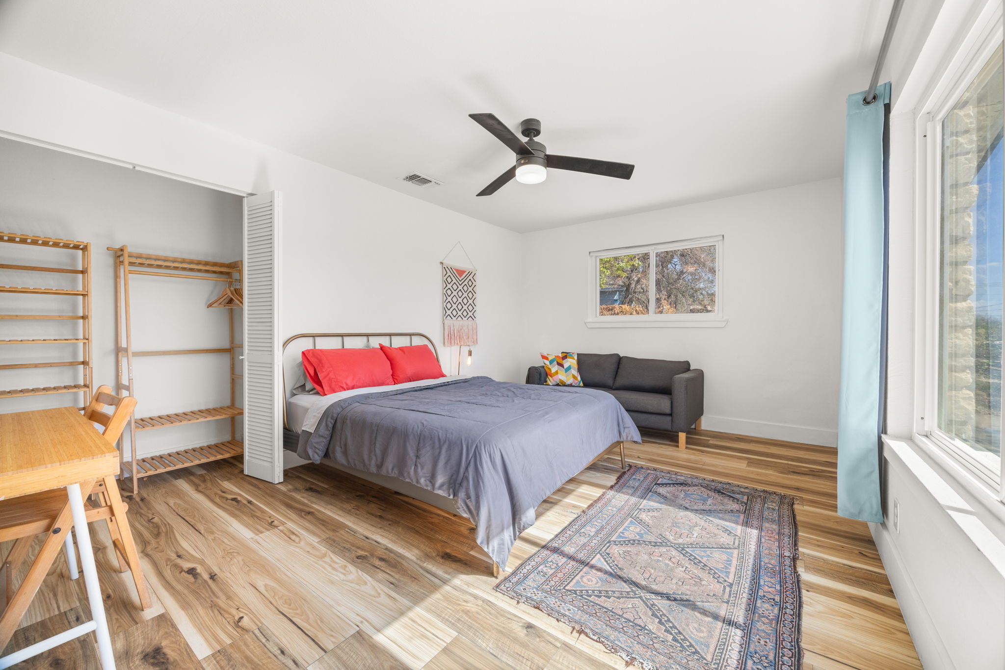 5002 Ledesma Road Austin, TX 78721 - Photo 17 of 32 a bedroom with a bed and a large window