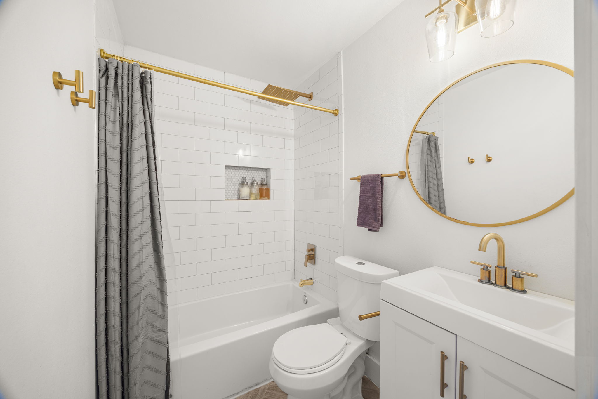 5002 Ledesma Road Austin, TX 78721 - Photo 19 of 32 a bathroom with a sink toilet and shower