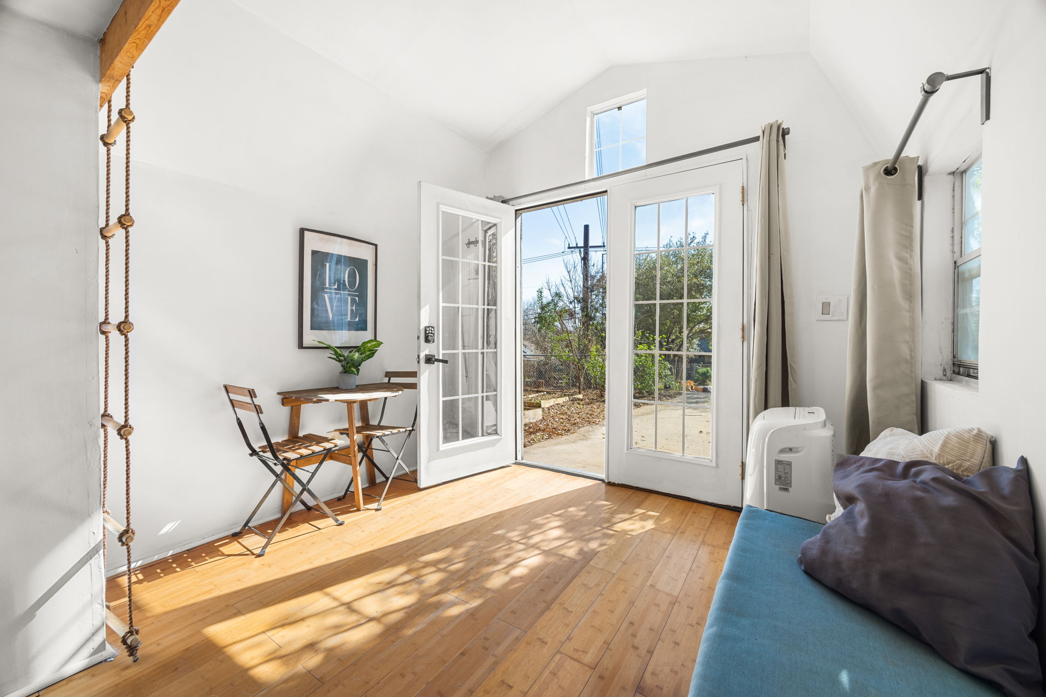 5002 Ledesma Road Austin, TX 78721 - Photo 24 of 32 a bedroom with furniture and a large window