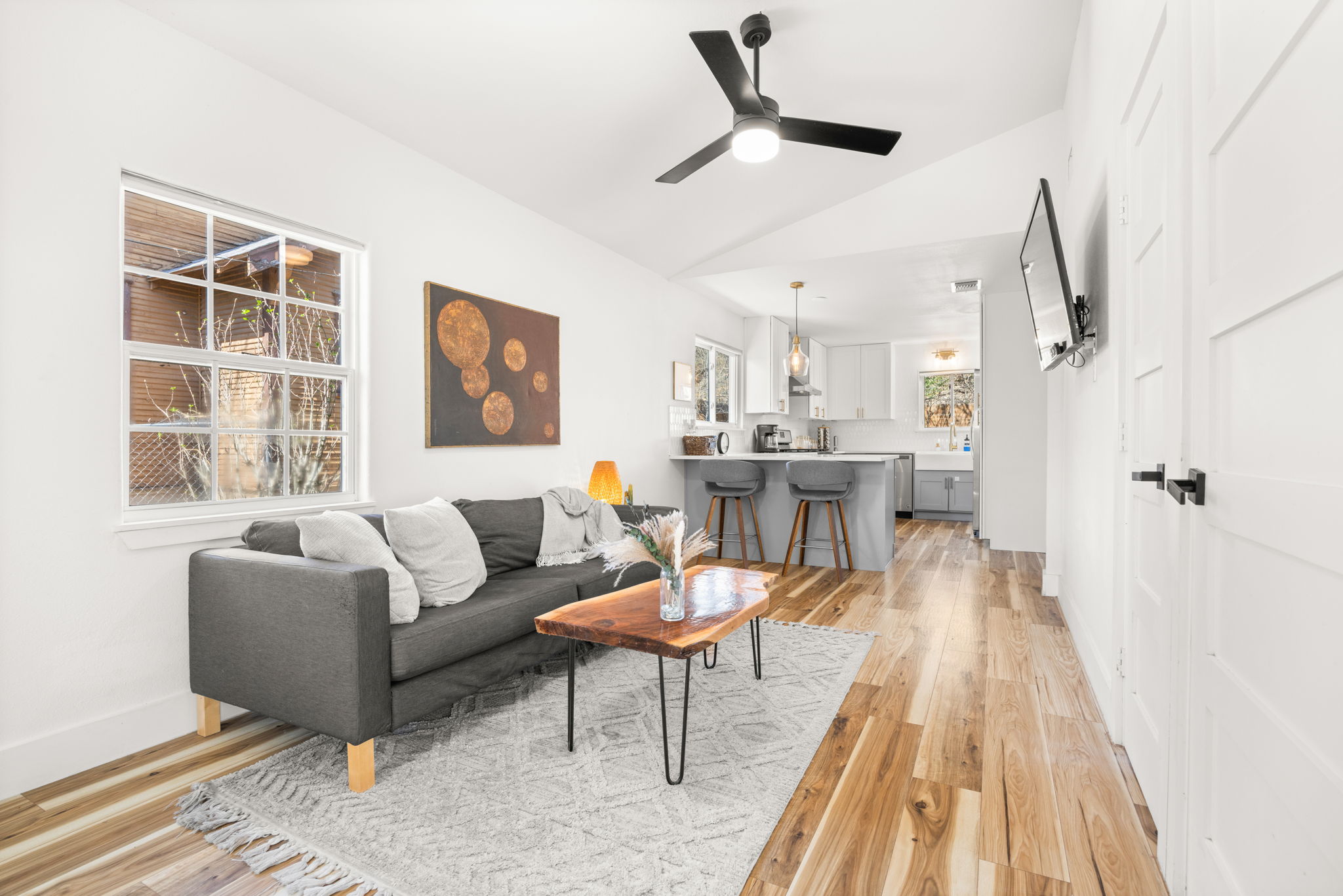 5002 Ledesma Road Austin, TX 78721 - Photo 5 of 32 a living room with furniture and a wooden floor