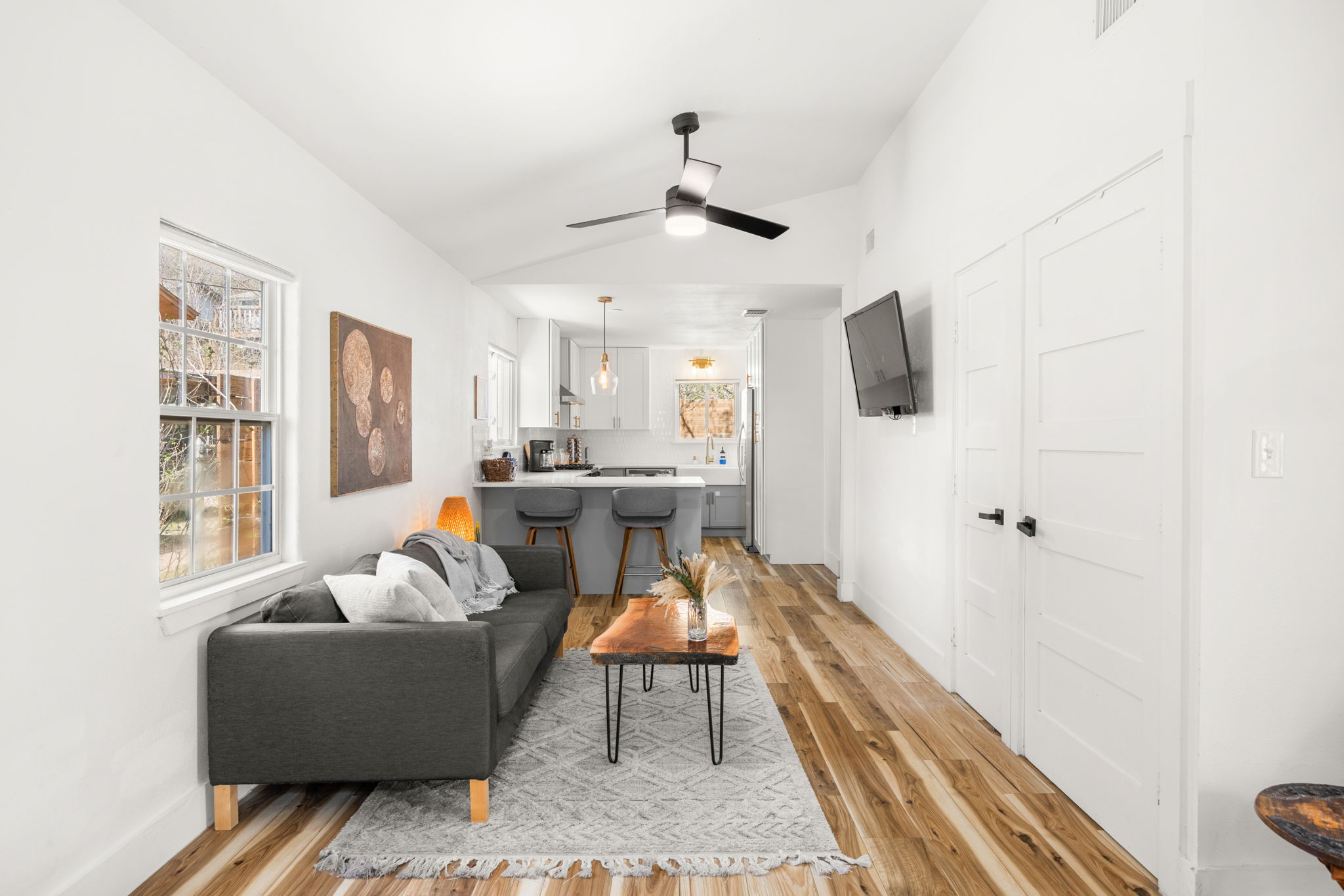 5002 Ledesma Road Austin, TX 78721 - Photo 7 of 32 a living room with furniture and a chandelier