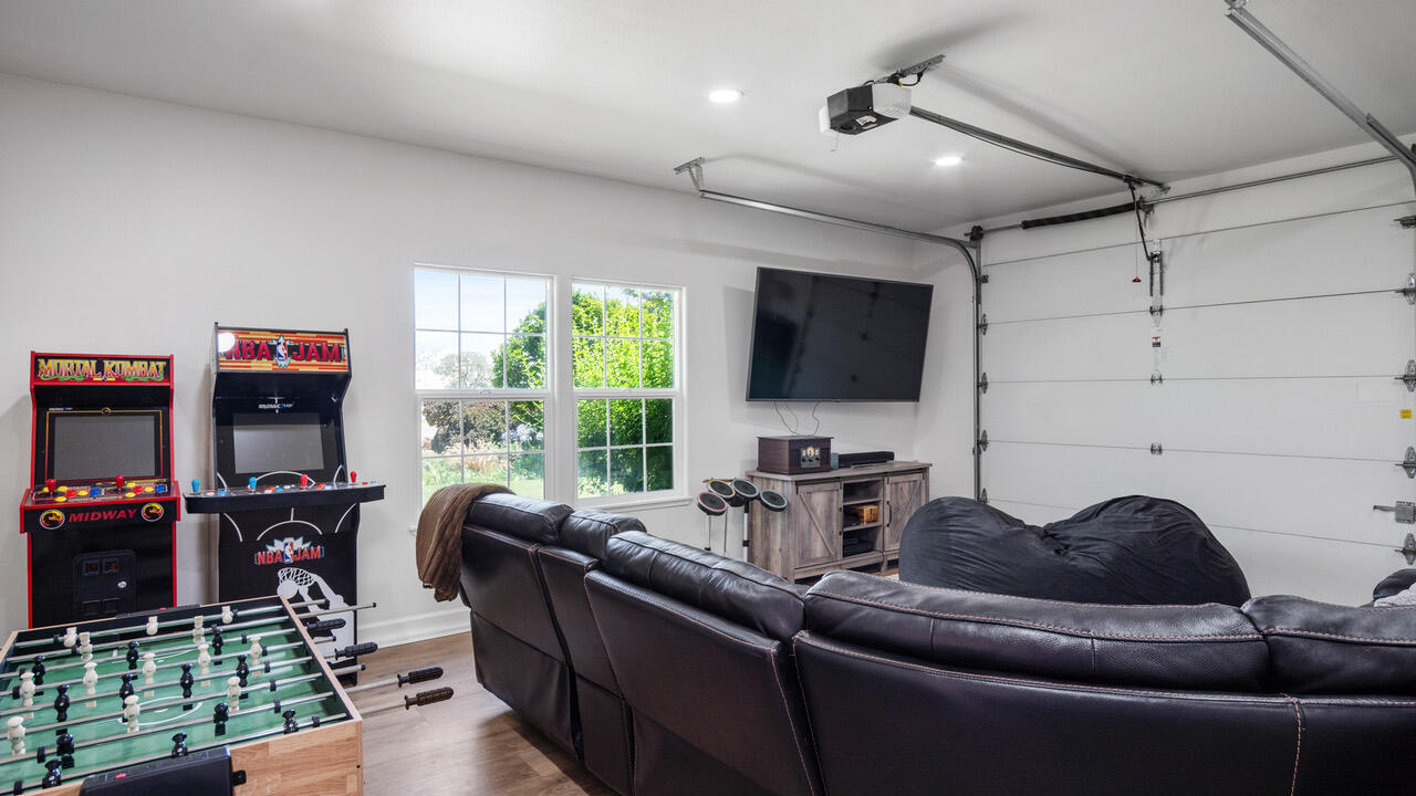 16657 Thomas Drive Springville, CA 93265 - Photo 26 of 37 a living room with furniture a flat screen tv and a floor to ceiling window