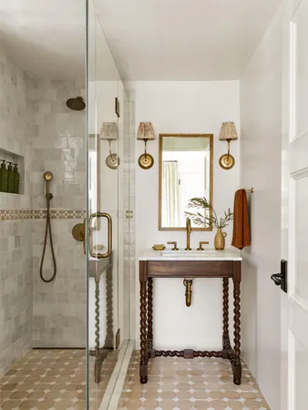 a bathroom with a granite countertop sink a mirror and shower
