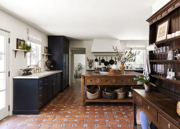 a kitchen with a stove and a refrigerator