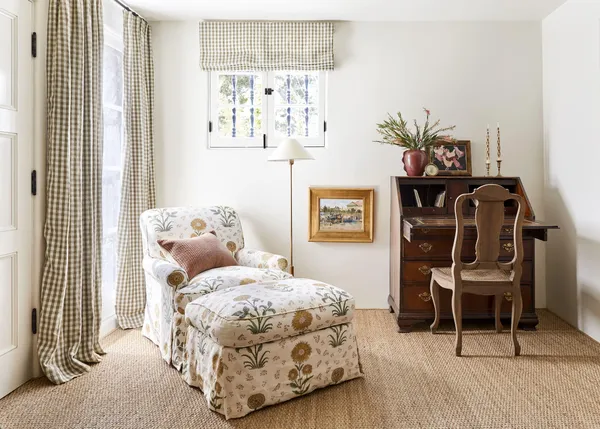 a bedroom with a bed and a table