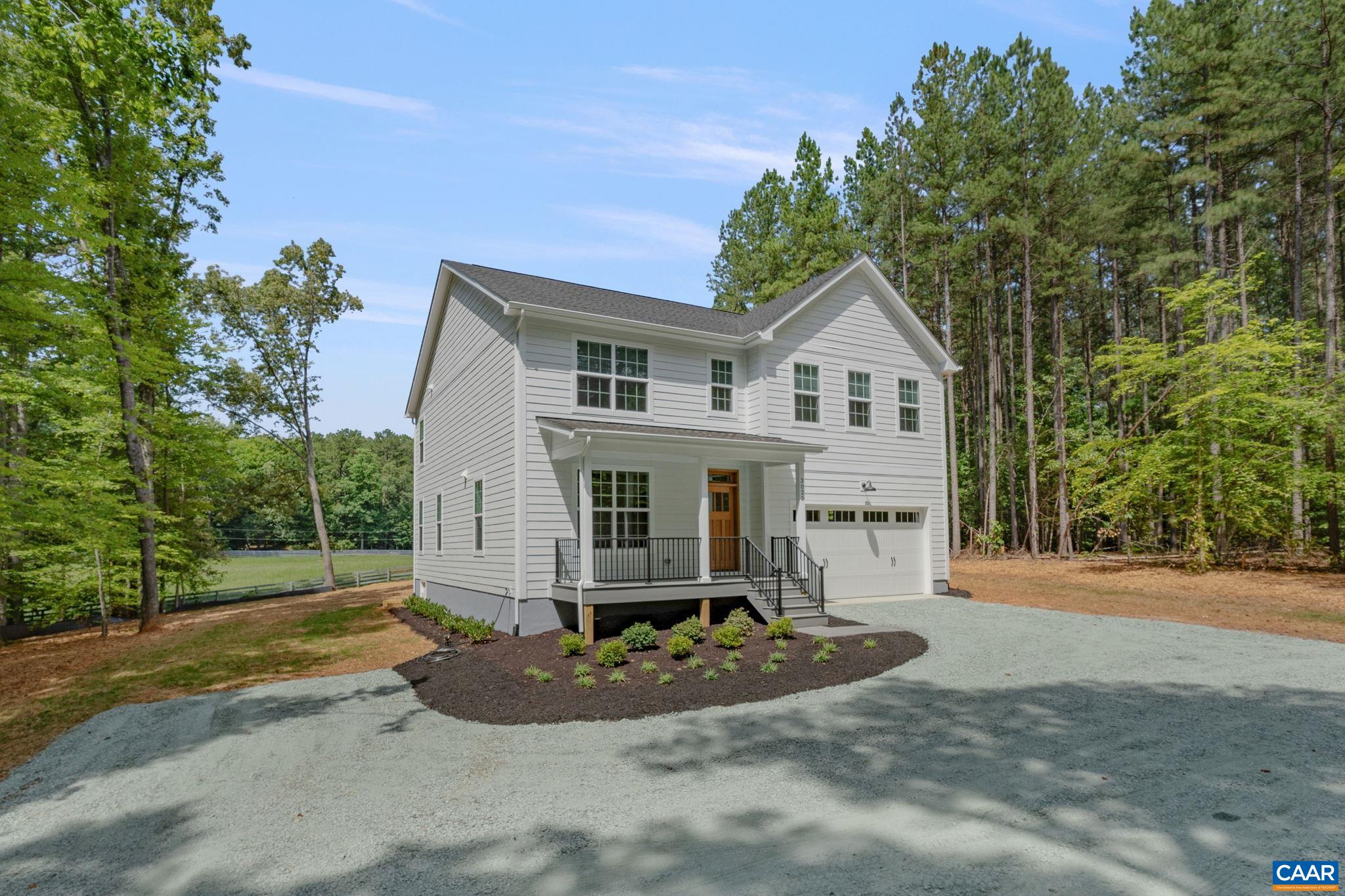 3 Lonicera Way Charlottesville, VA 22911 - Photo 1 of 31 a front view of a house with a yard and garage