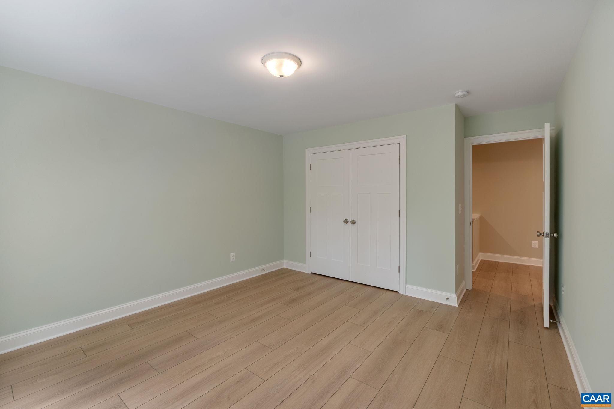 3 Lonicera Way Charlottesville, VA 22911 - Photo 24 of 31 a view of an empty room with wooden floor