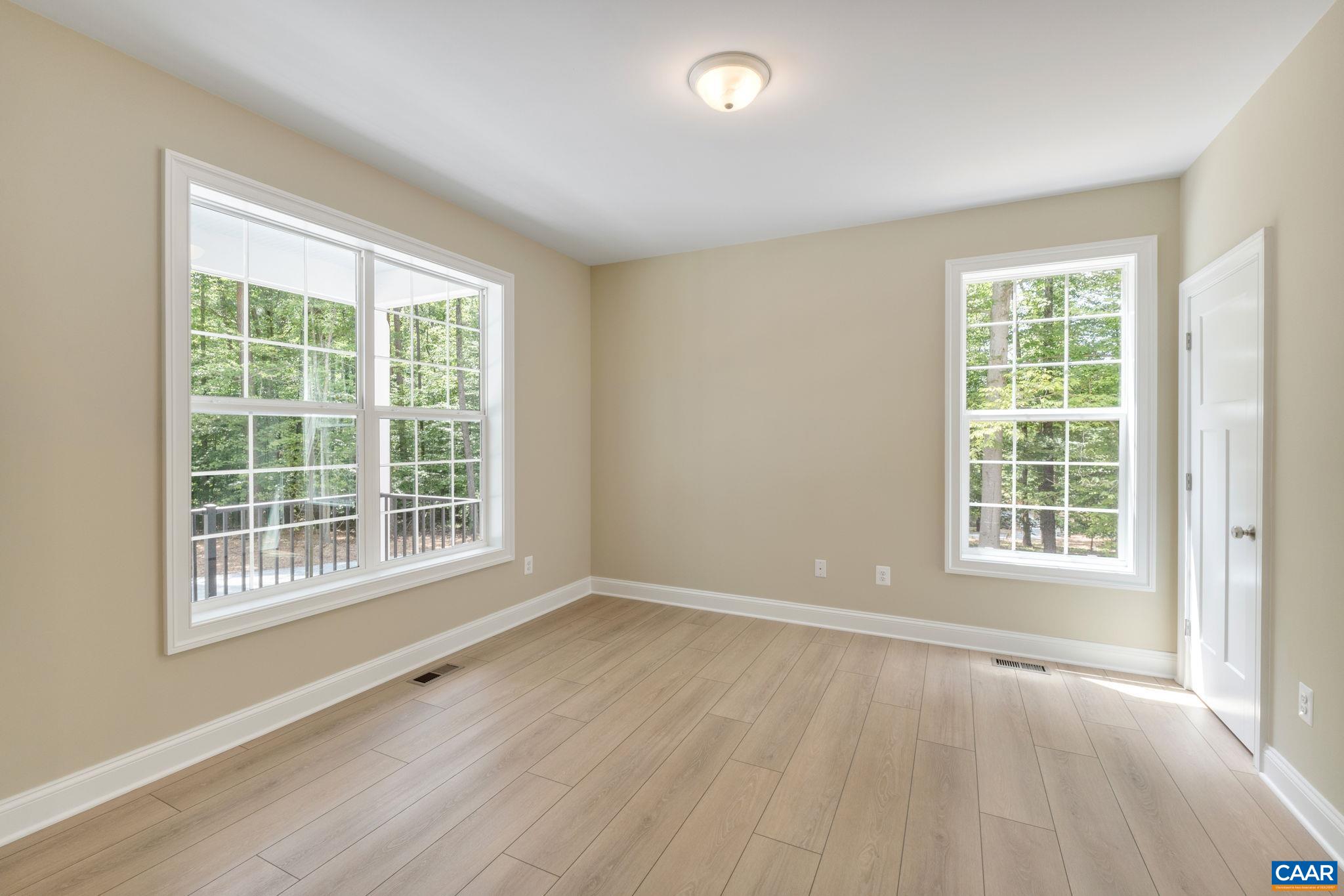 3 Lonicera Way Charlottesville, VA 22911 - Photo 26 of 31 an empty room with wooden floor and windows