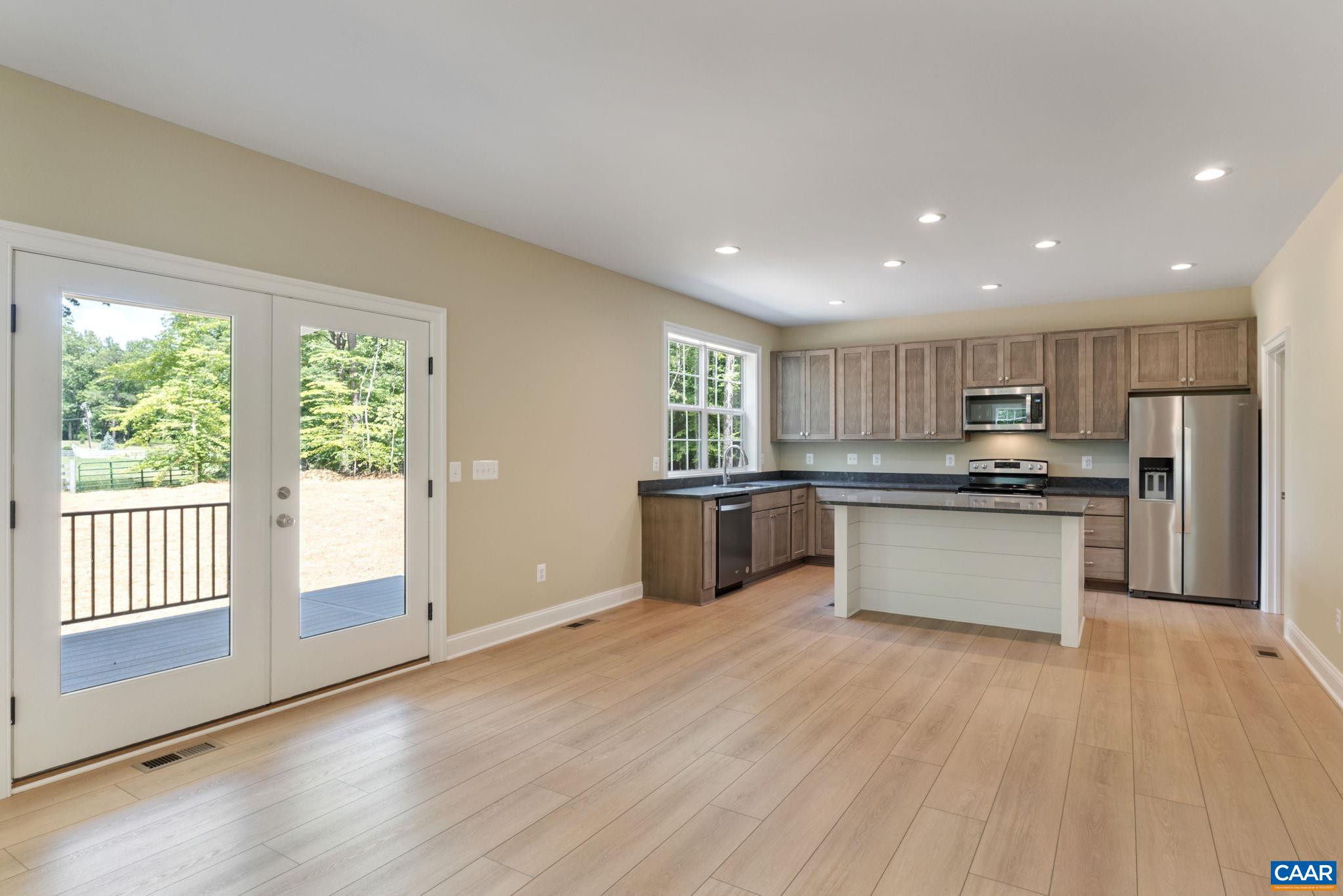 3 Lonicera Way Charlottesville, VA 22911 - Photo 4 of 31 a kitchen with stainless steel appliances granite countertop a stove a sink and a refrigerator