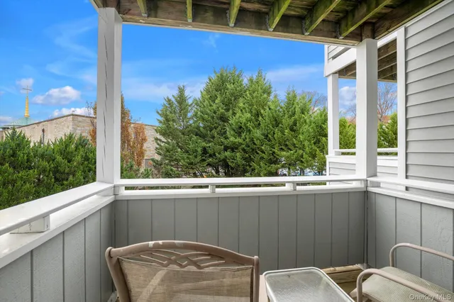 a view of a balcony with chair