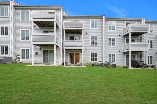 a front view of building with yard