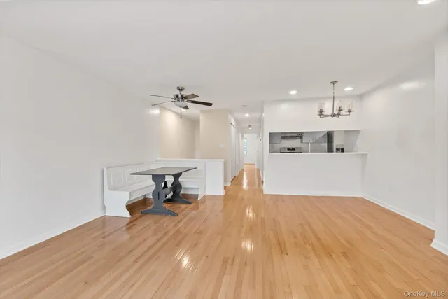 a view of a kitchen with a sink and wooden floor
