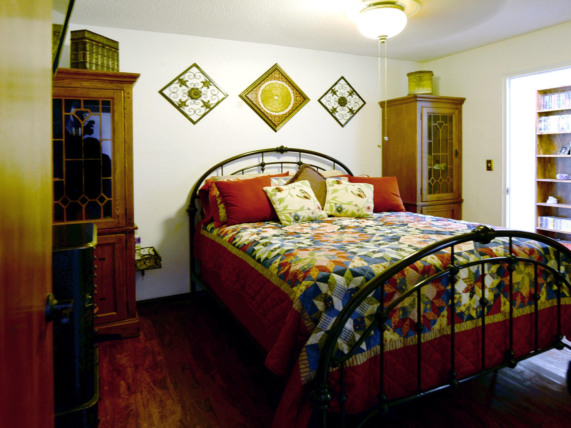 107 Salem Road Oak Ridge, TN 37830 - Photo 15 of 25 a bedroom with a bed and a mirror on the dresser