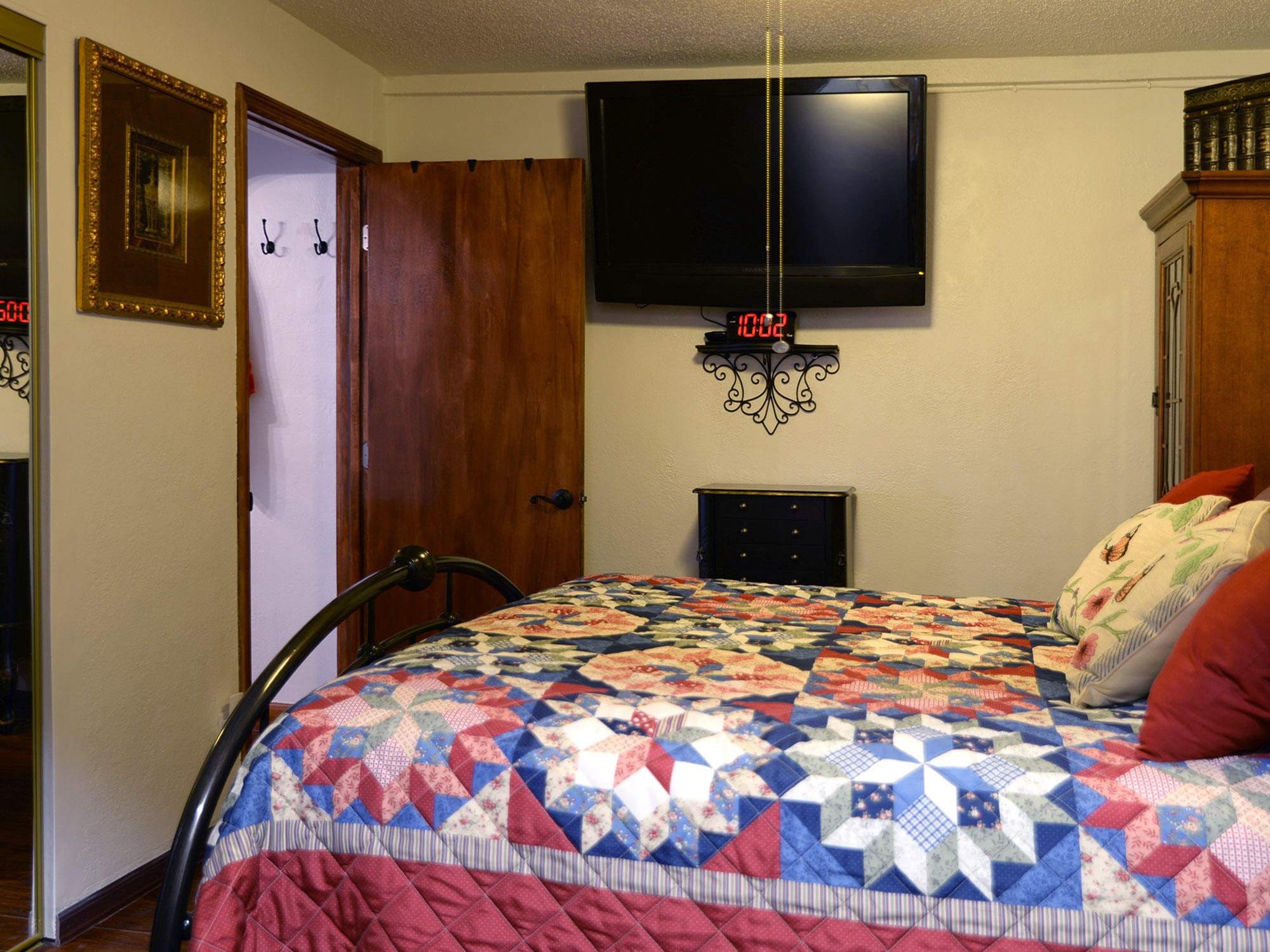 107 Salem Road Oak Ridge, TN 37830 - Photo 16 of 25 a bedroom with a bed and a flat screen tv