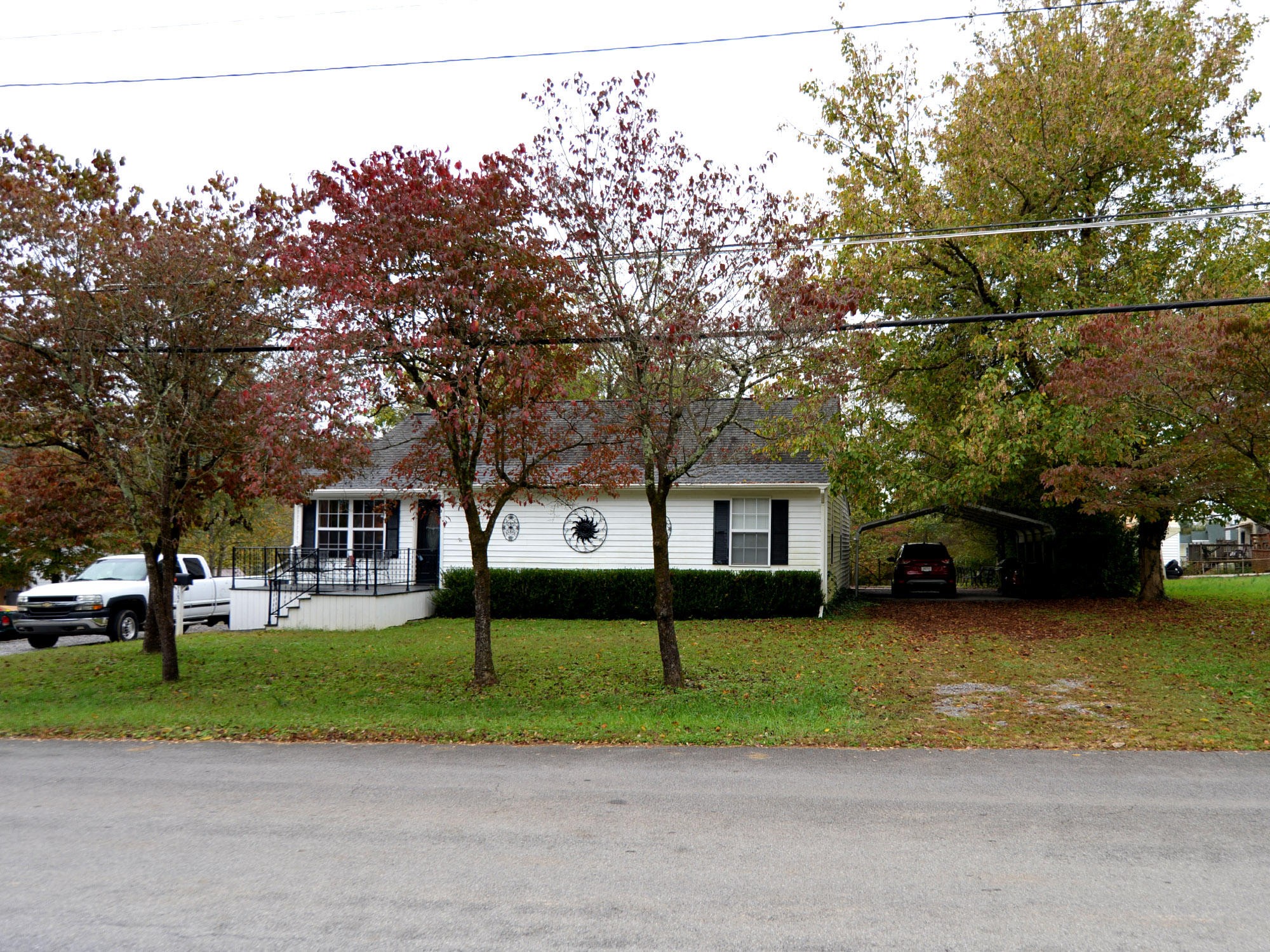 107 Salem Road Oak Ridge, TN 37830 - Photo 3 of 25 a view of a house with a big yard and large trees