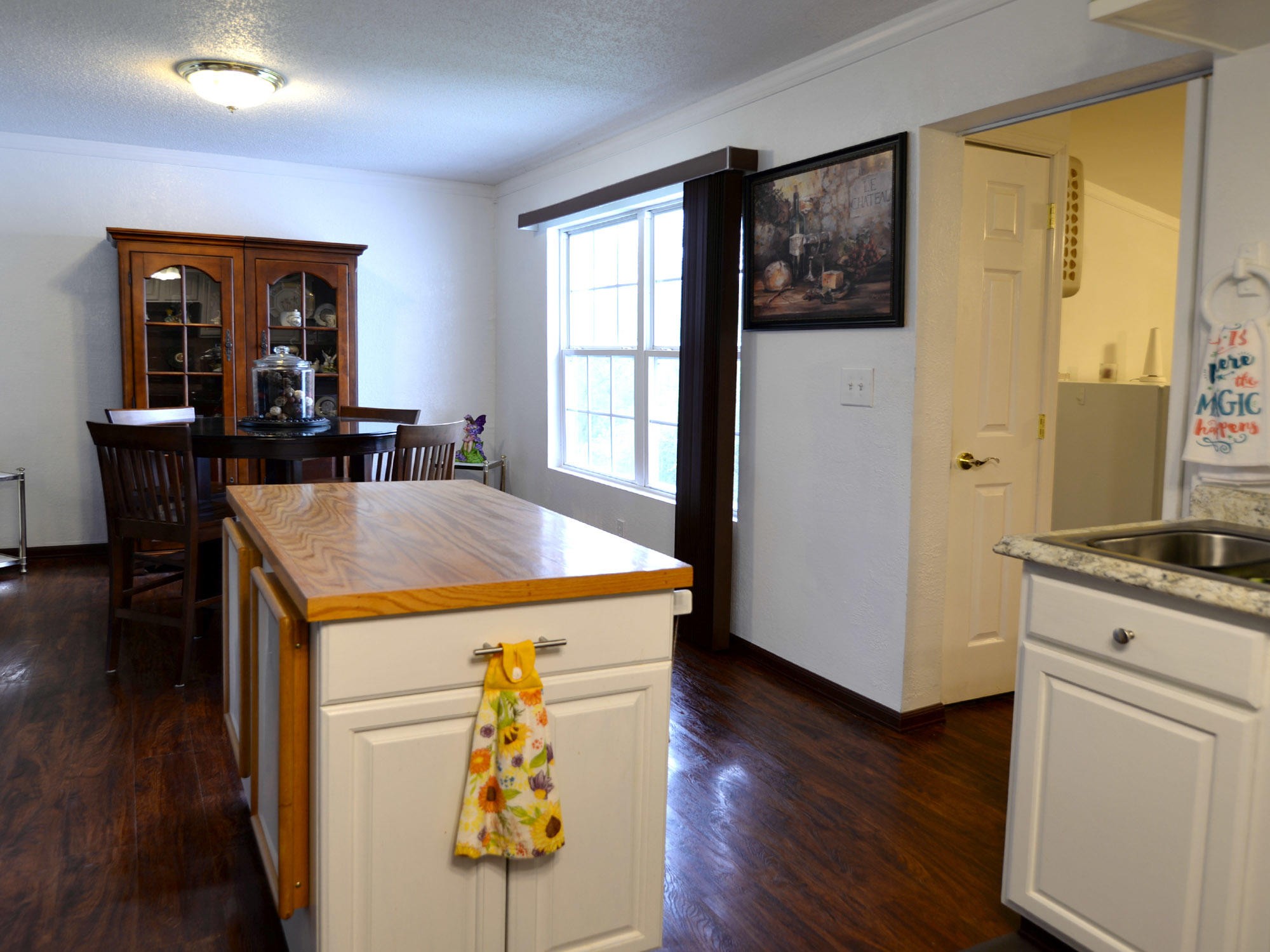 107 Salem Road Oak Ridge, TN 37830 - Photo 6 of 25 a kitchen with a refrigerator and a stove top oven