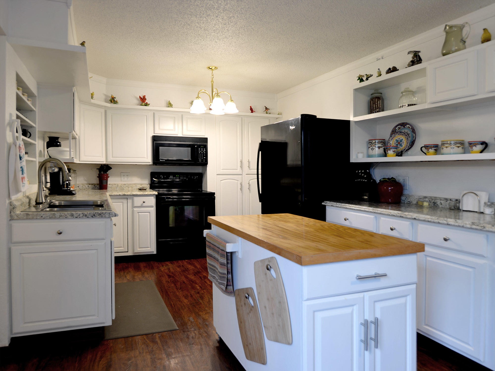 107 Salem Road Oak Ridge, TN 37830 - Photo 8 of 25 a kitchen with granite countertop a refrigerator stove and sink