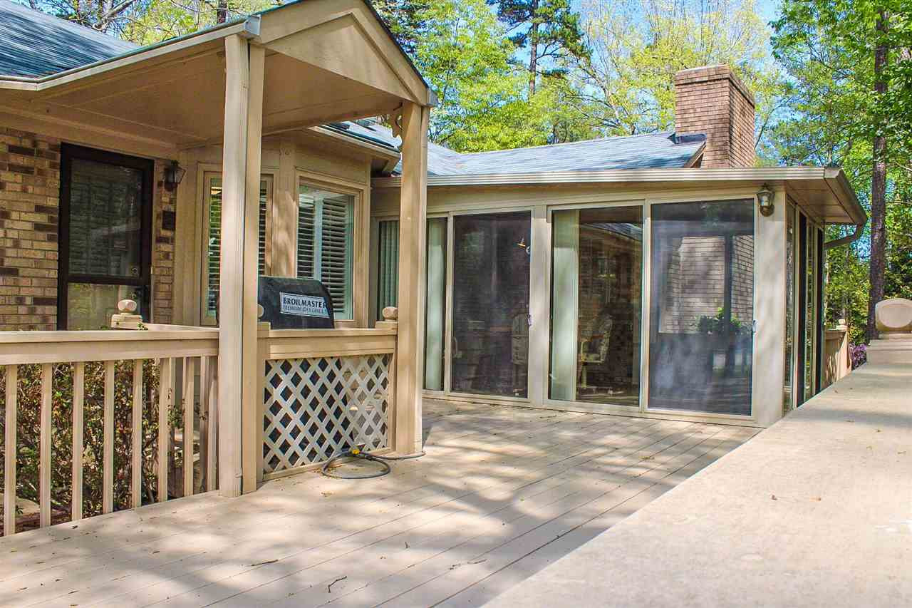 9444 Springdale Drive Raleigh, NC 27613 - Photo 8 of 25 Oversized deck off of the sunroom. Covered area for natural gas grill with hard line. Patio/Deck