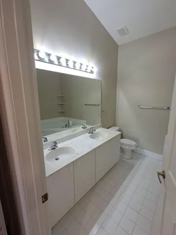 a bathroom with a sink and mirror