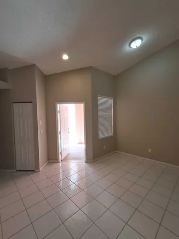 a view of an empty room and window