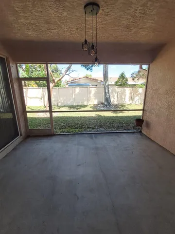 a view of room with window and hallway